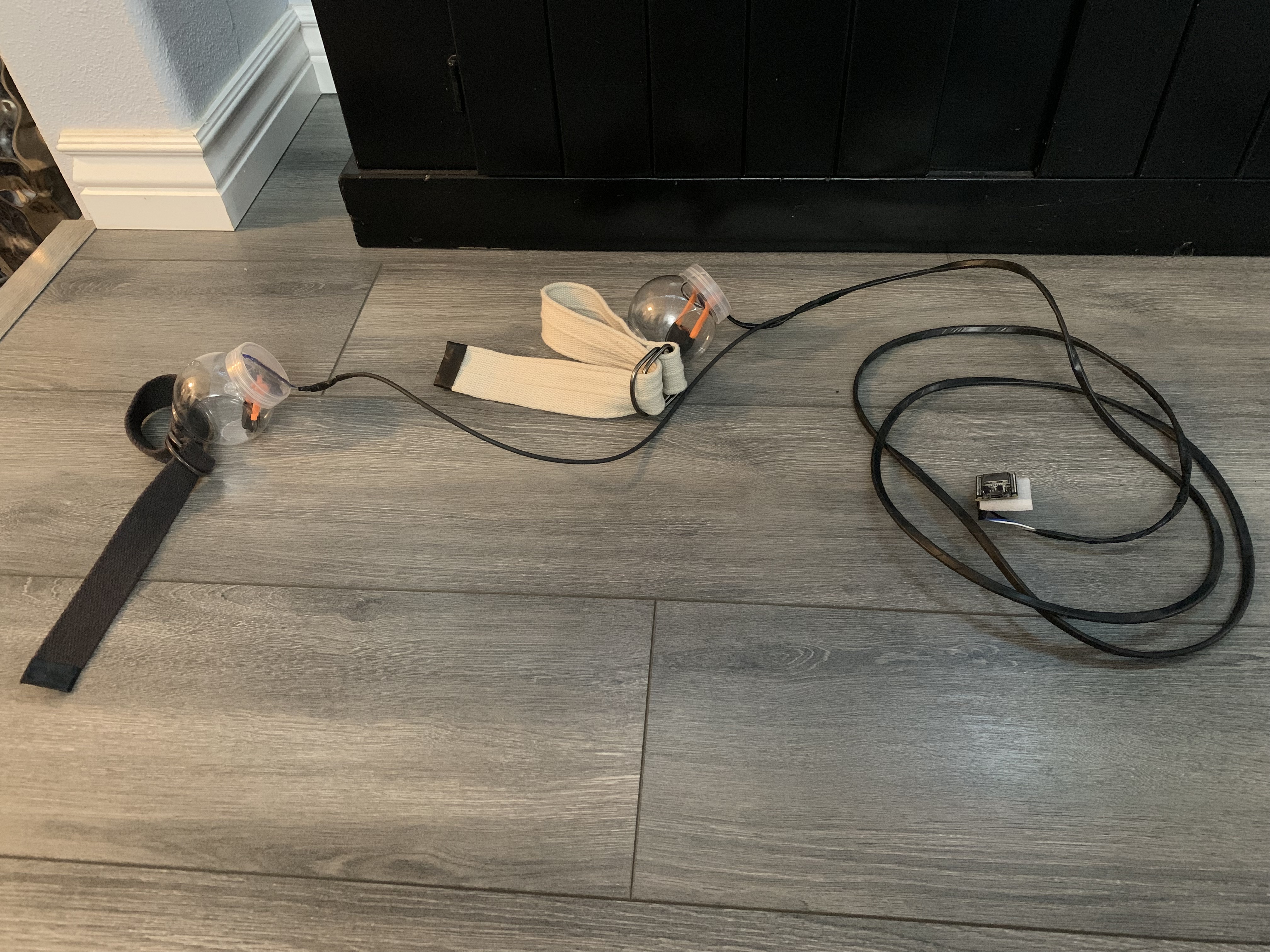 Wired system consisting a microcontroller and two angle sensors in plastic containers.