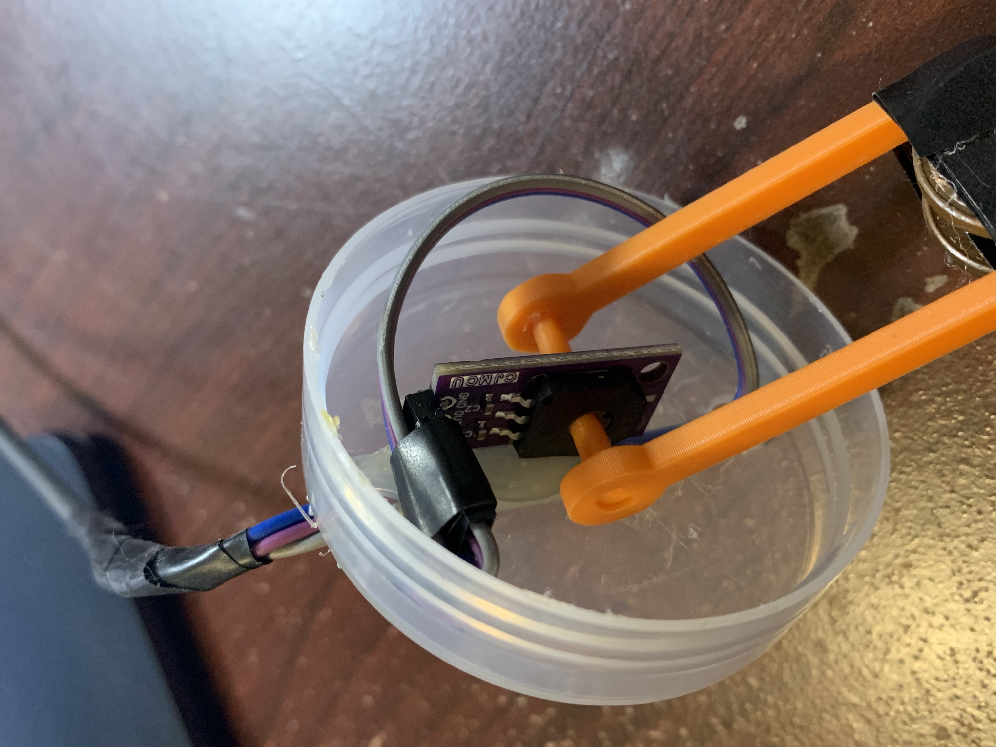 An angle sensor module with a plastic lever attached to the rotor.